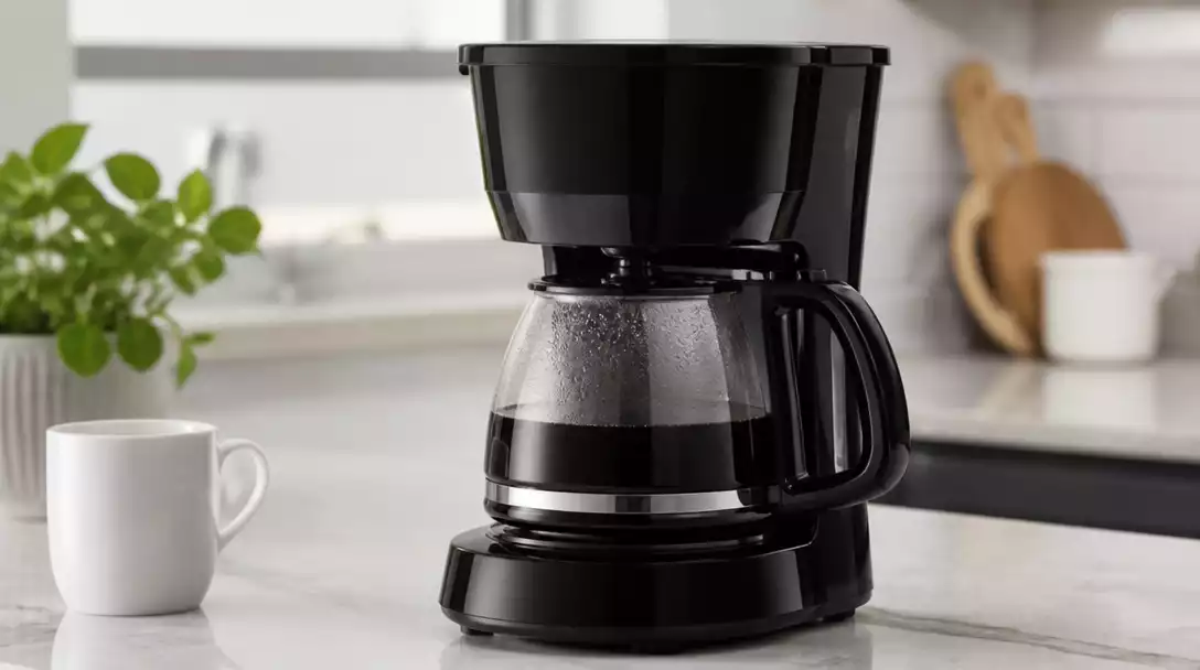 Proctor Silex coffee maker on a kitchen counter, clean and ready for use