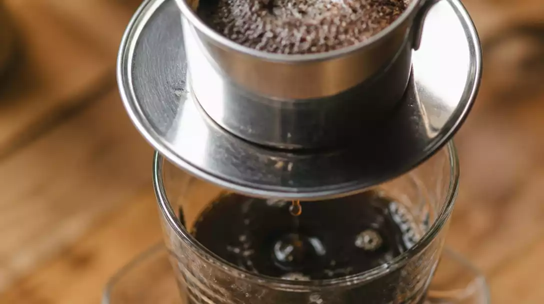 Vietnamese phin filter brewing coffee